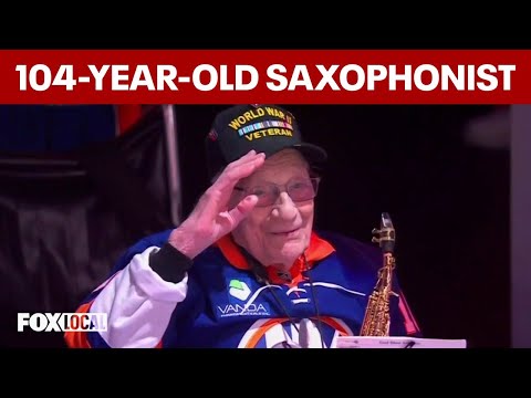 104-year-old WWII veteran Dominic Critelli playing saxophone at UBS Arena